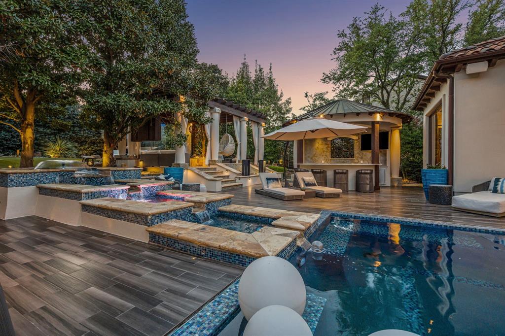 Backyard water and fire features, a spa with fire and stone stepping-stones across the water